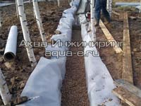 Щебень закрывает дренажную трубу